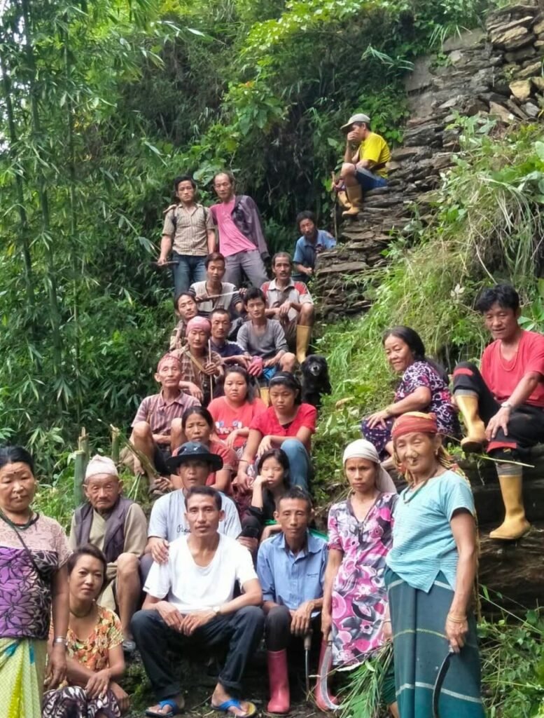 Mangsabung village community members who collectively built the stone step pathway to Sigey Pokthang, supporting safe access during Yuksom Sightseeing in West Sikkim.